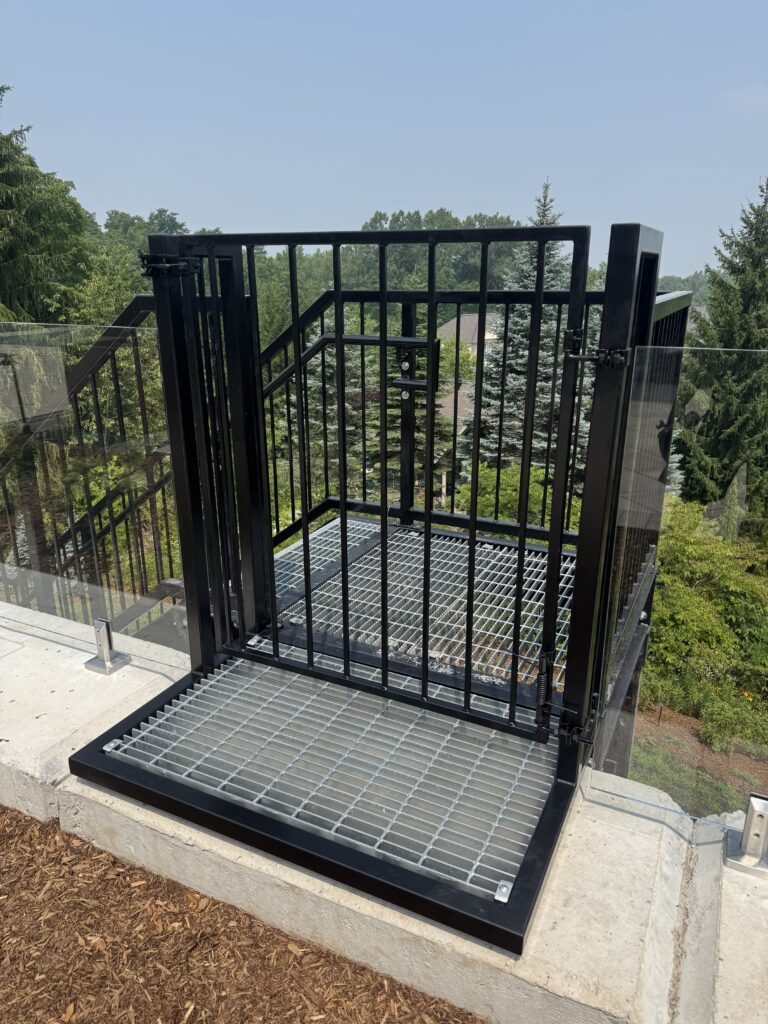 Decorative black metal window well cover with diamond pattern. Metal window well cover, powder coated Oil rubbed bronze. Deck window well cover, fire access, Safety access cover.