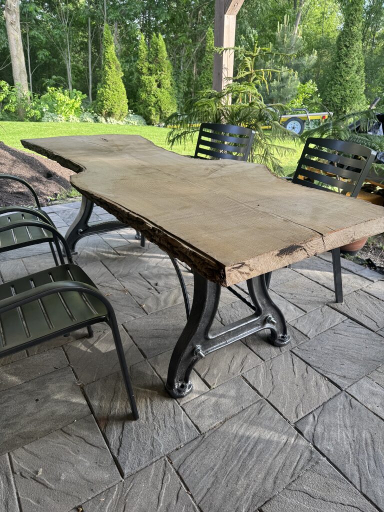 Custom wrought iron live edge table, exterior.