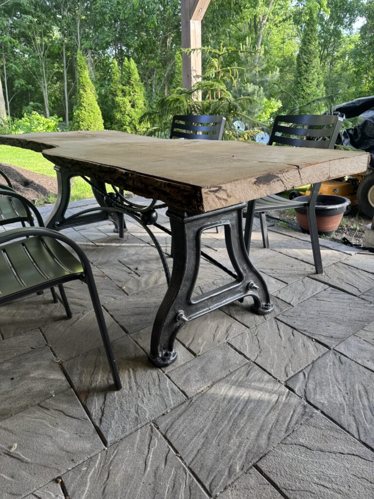 Custom wrought iron live edge table, exterior.
