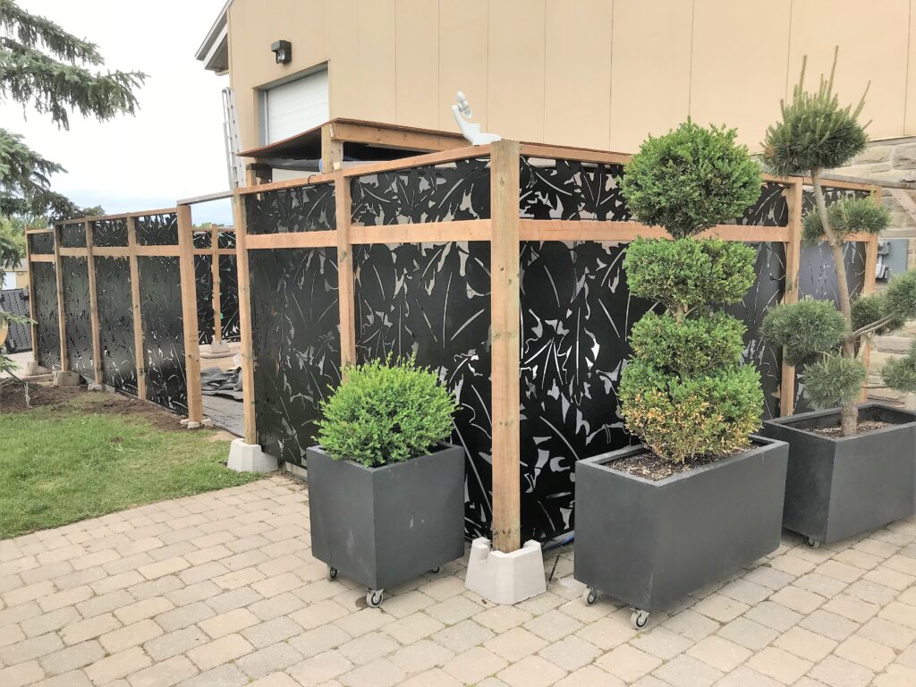 Decorative black metal fence with leaf patterns, laser cut design custom made. With steel frame.