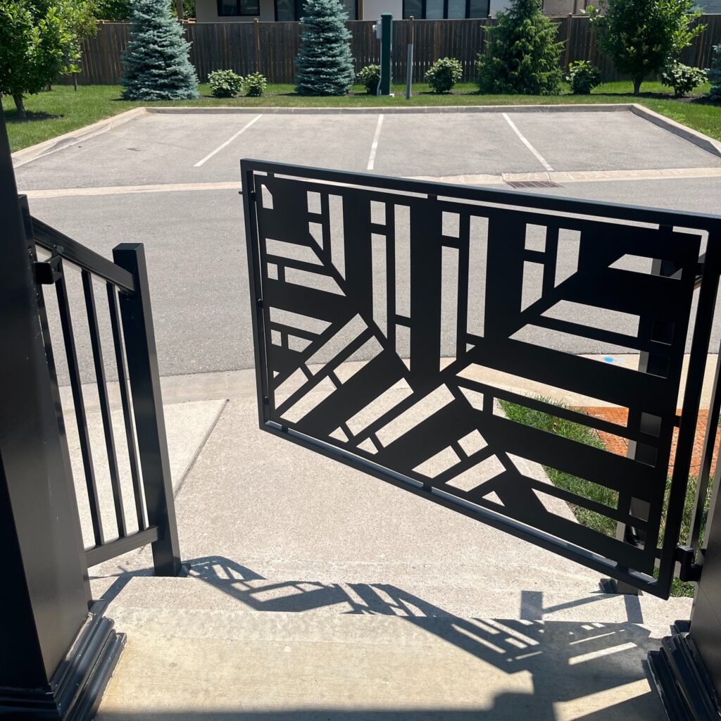 Modern pet gate with geometric design. Laser cut gate for pet safety, powder coated black.