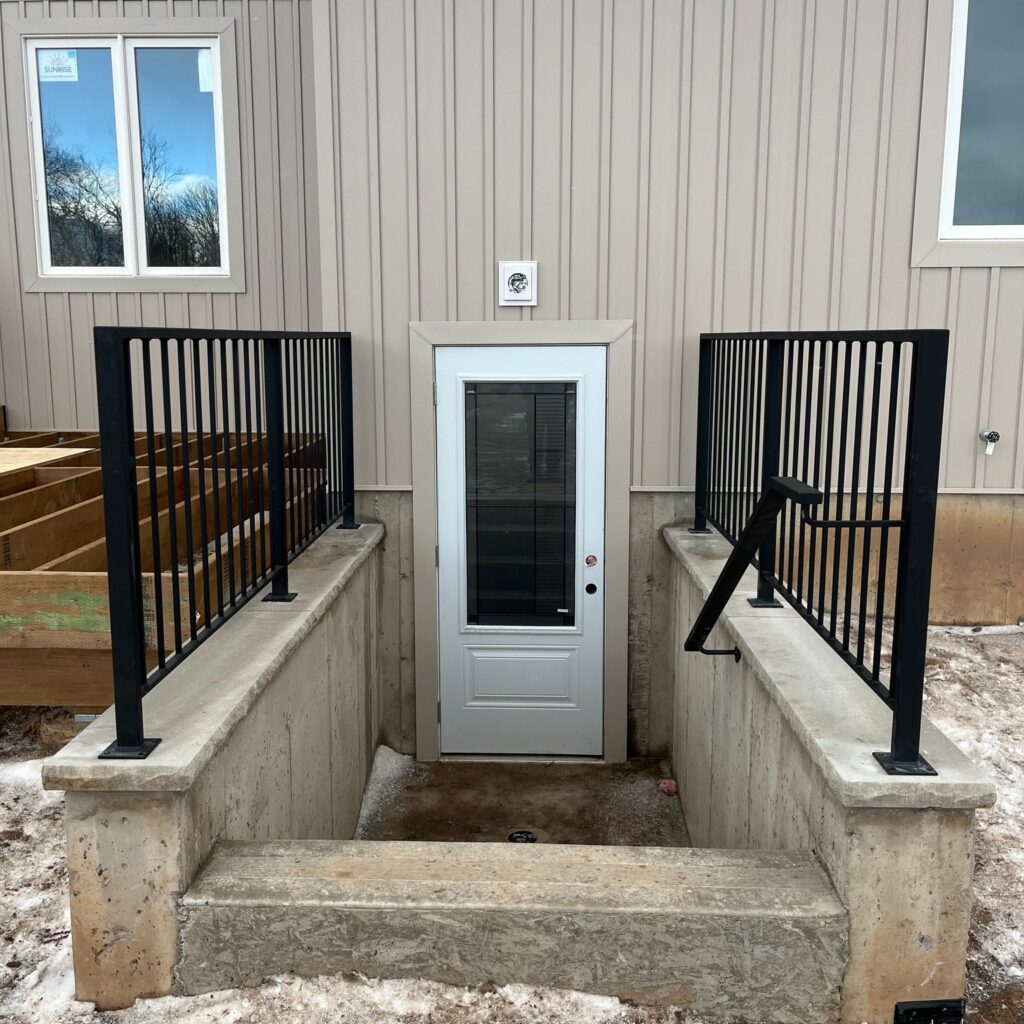 Modern basement railing solution, basement entry railings. Railings with handrail solution.