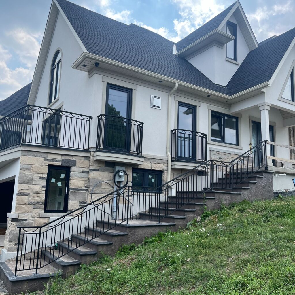 Wrought iron railings fabricated in the niagara region. Powder coated railings with juliet balcony railings in the background.