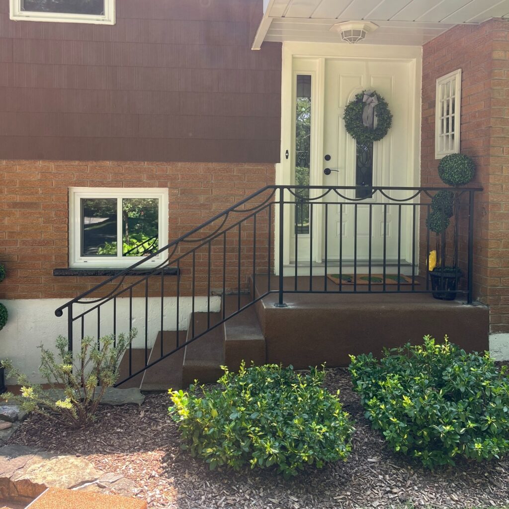 Wrought iron railings fabricated in the niagara region. Powder coated railings on a front porch. Located in Lincoln.