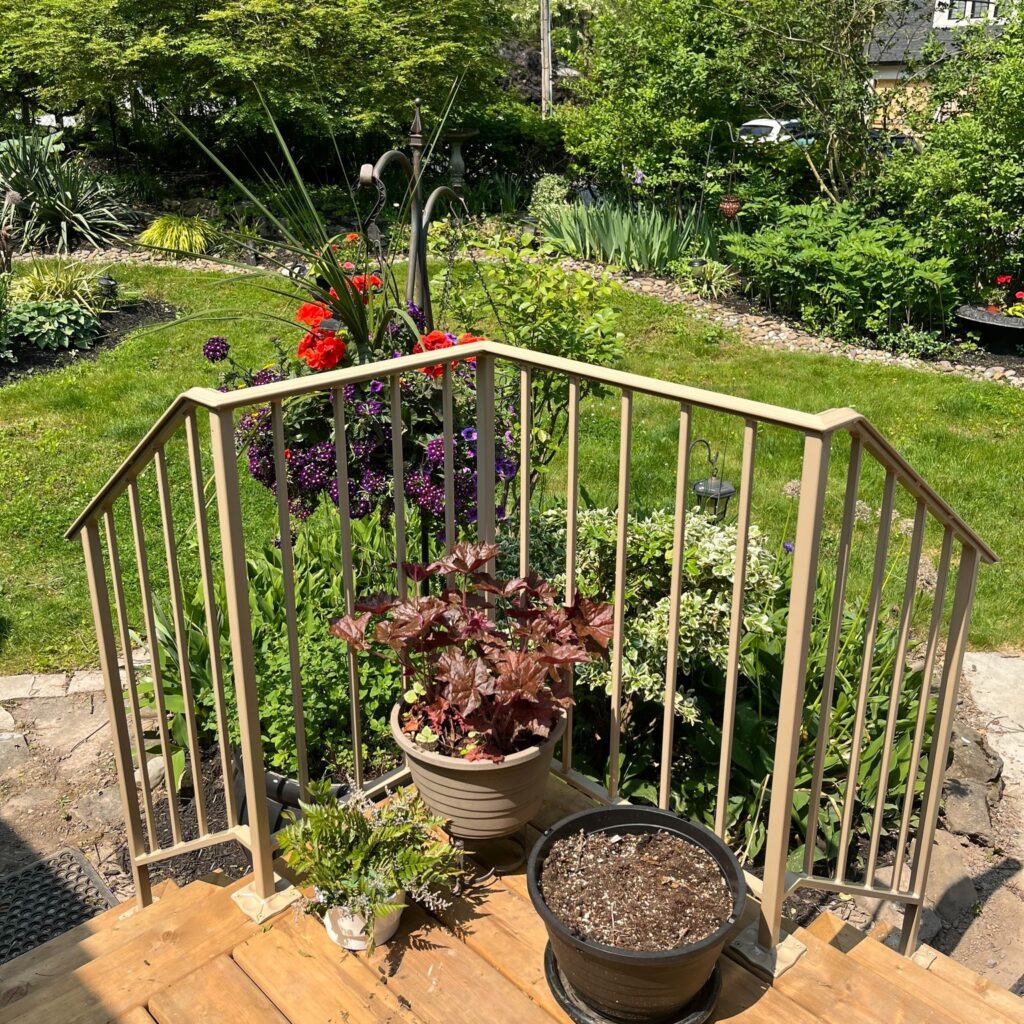 Wrought iron railings fabricated in the niagara region. Powder coated railings on a front porch. Located in Lincoln.