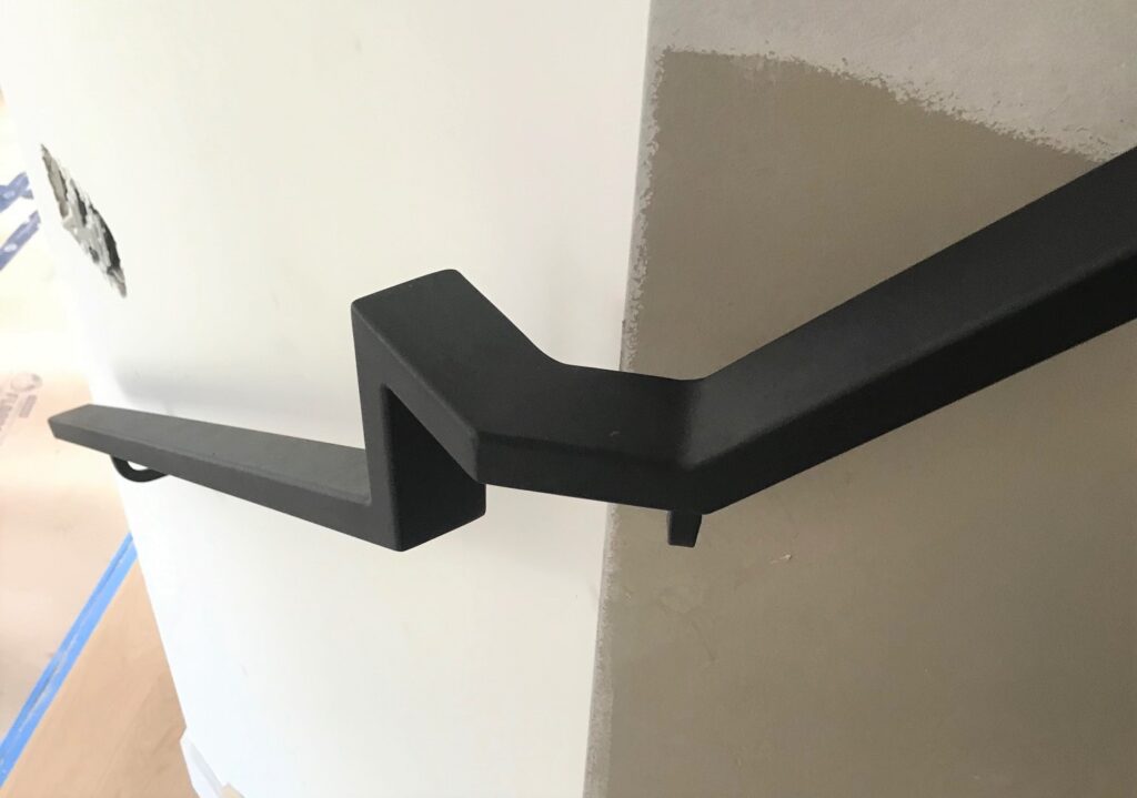 Modern steel handrail, wall mounted to the wall