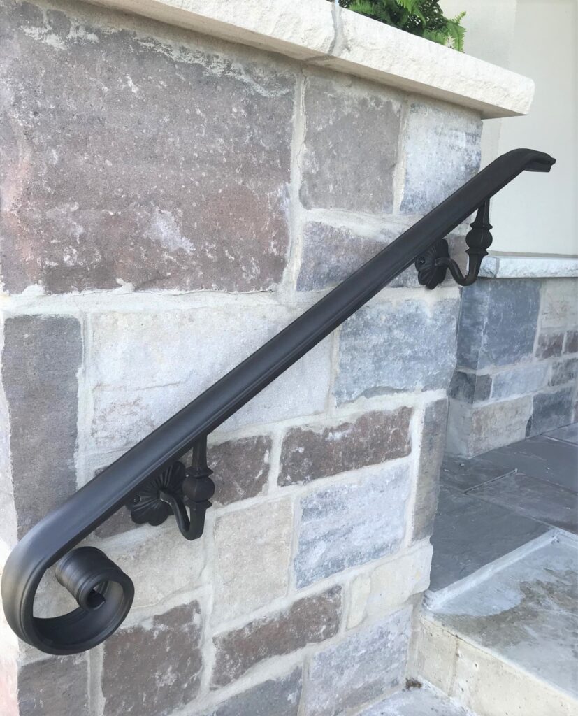 Modern steel handrail, wall mounted to the wall