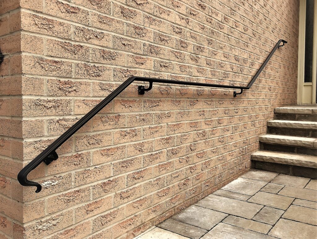 Modern steel handrail, wall mounted to the wall