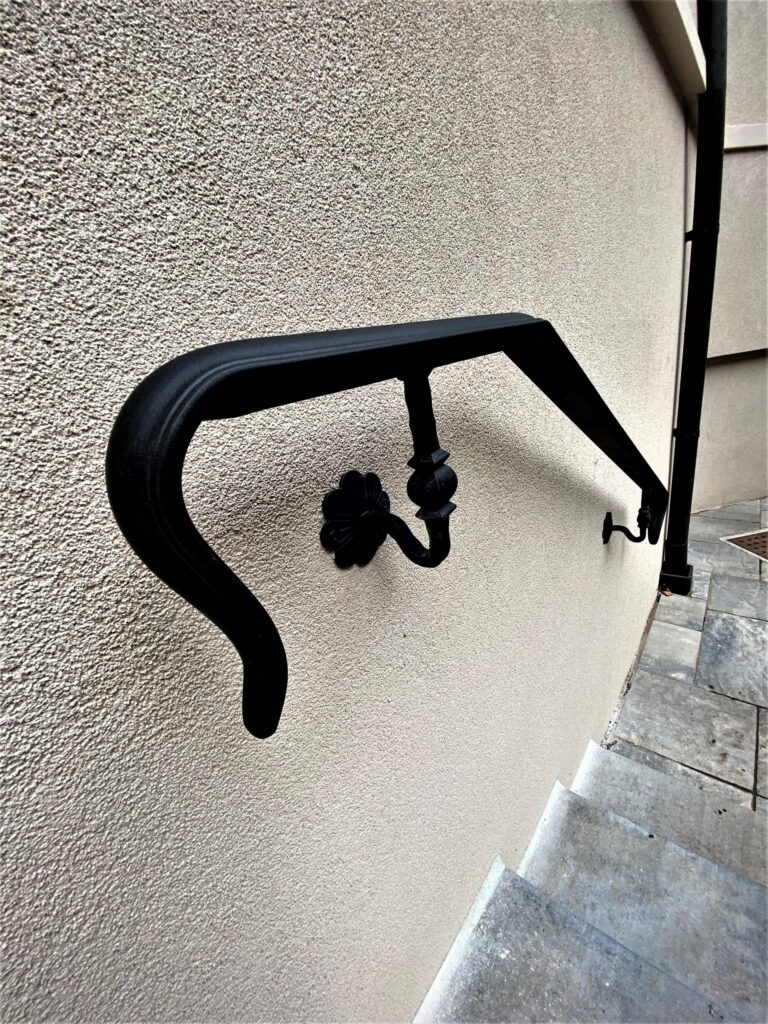 Modern steel handrail, wall mounted to the wall