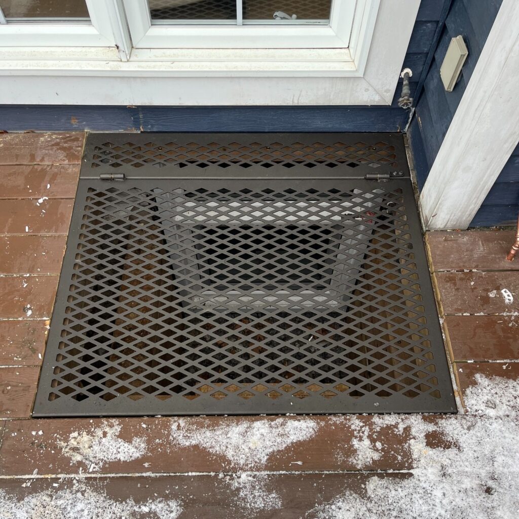 Decorative black metal window well cover with diamond pattern. Metal window well cover, powder coated Oil rubbed bronze. Deck window well cover, fire access, Safety access cover.